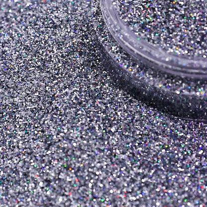 Silver glitter with a container on a textured surface