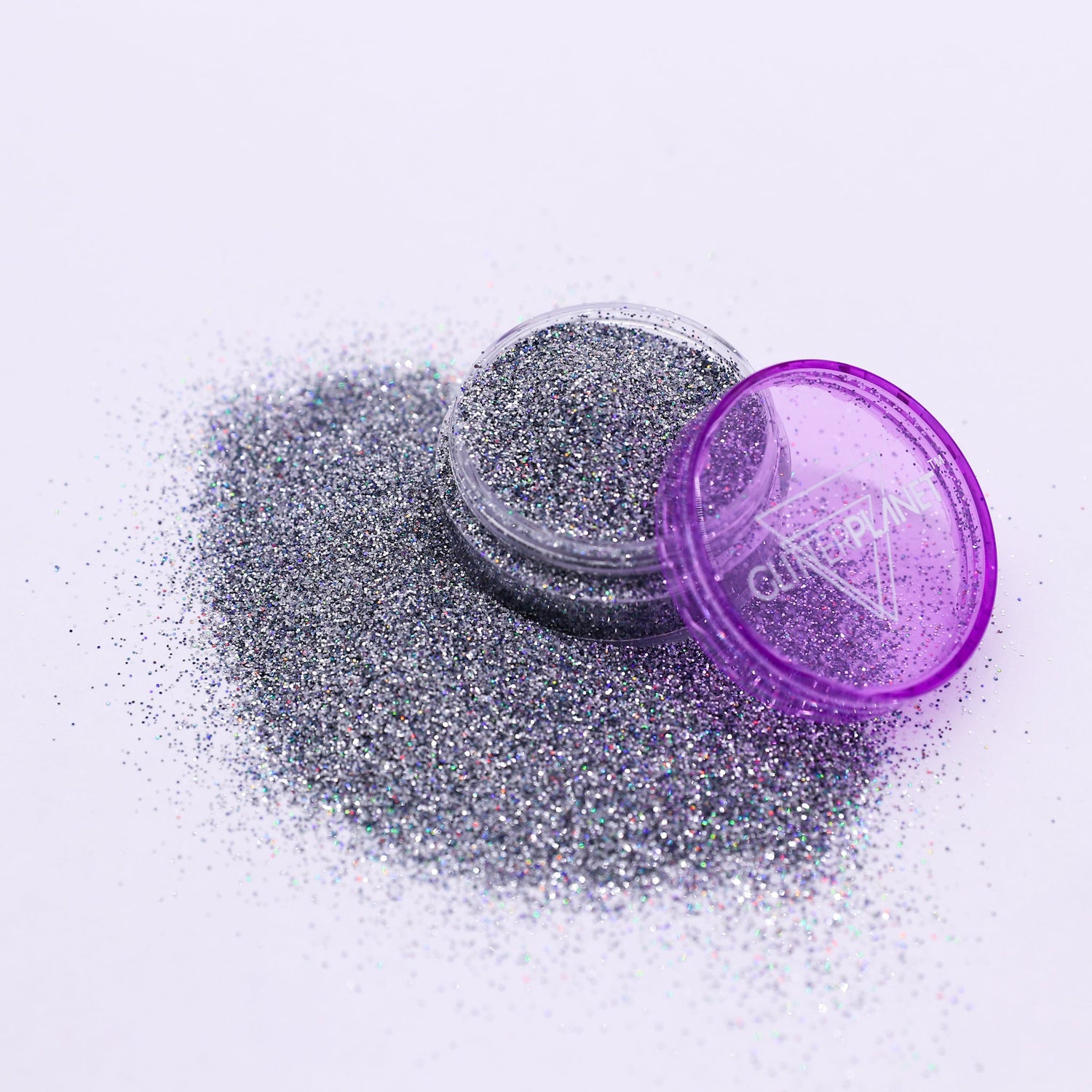Silver glitter with a purple container on a white background