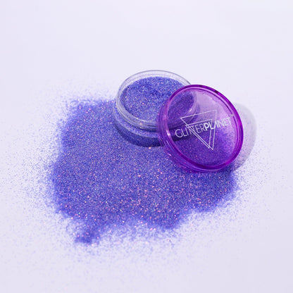 Purple glitter jar with open lid on a white background