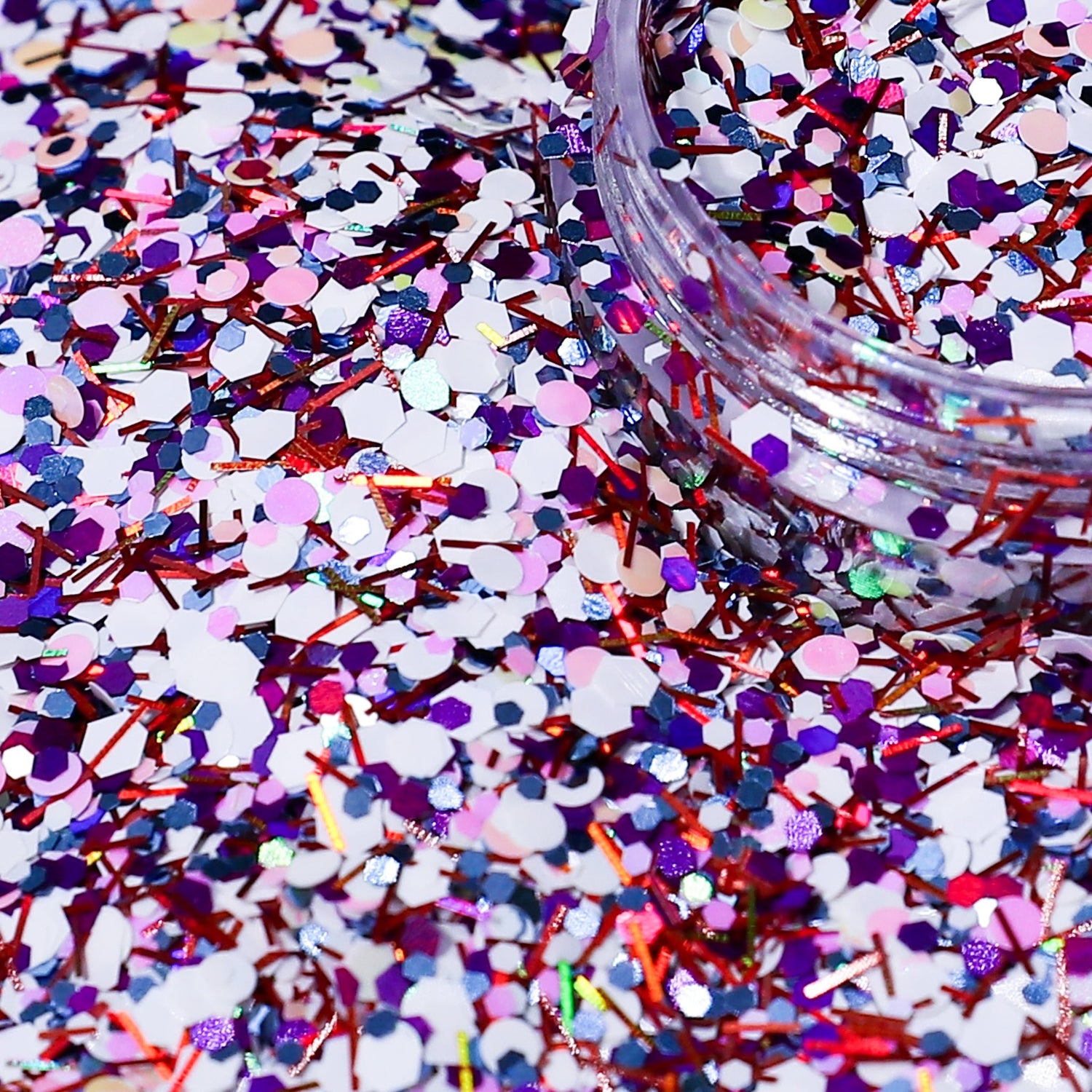 Colorful glitter with a jar of glitter on a multicolored background