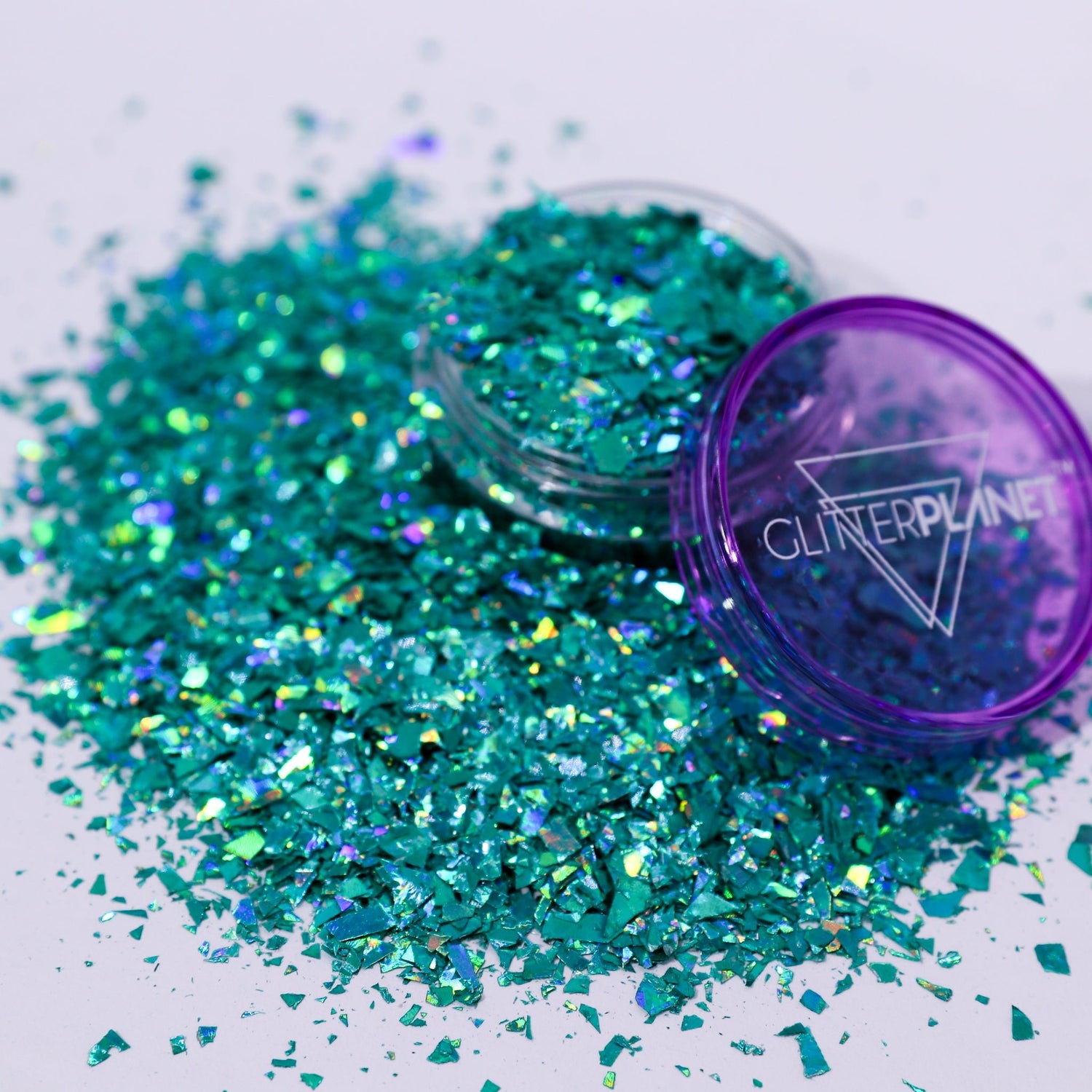 Turquoise glitter with a purple container labeled &