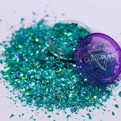Turquoise glitter with a purple container labeled &