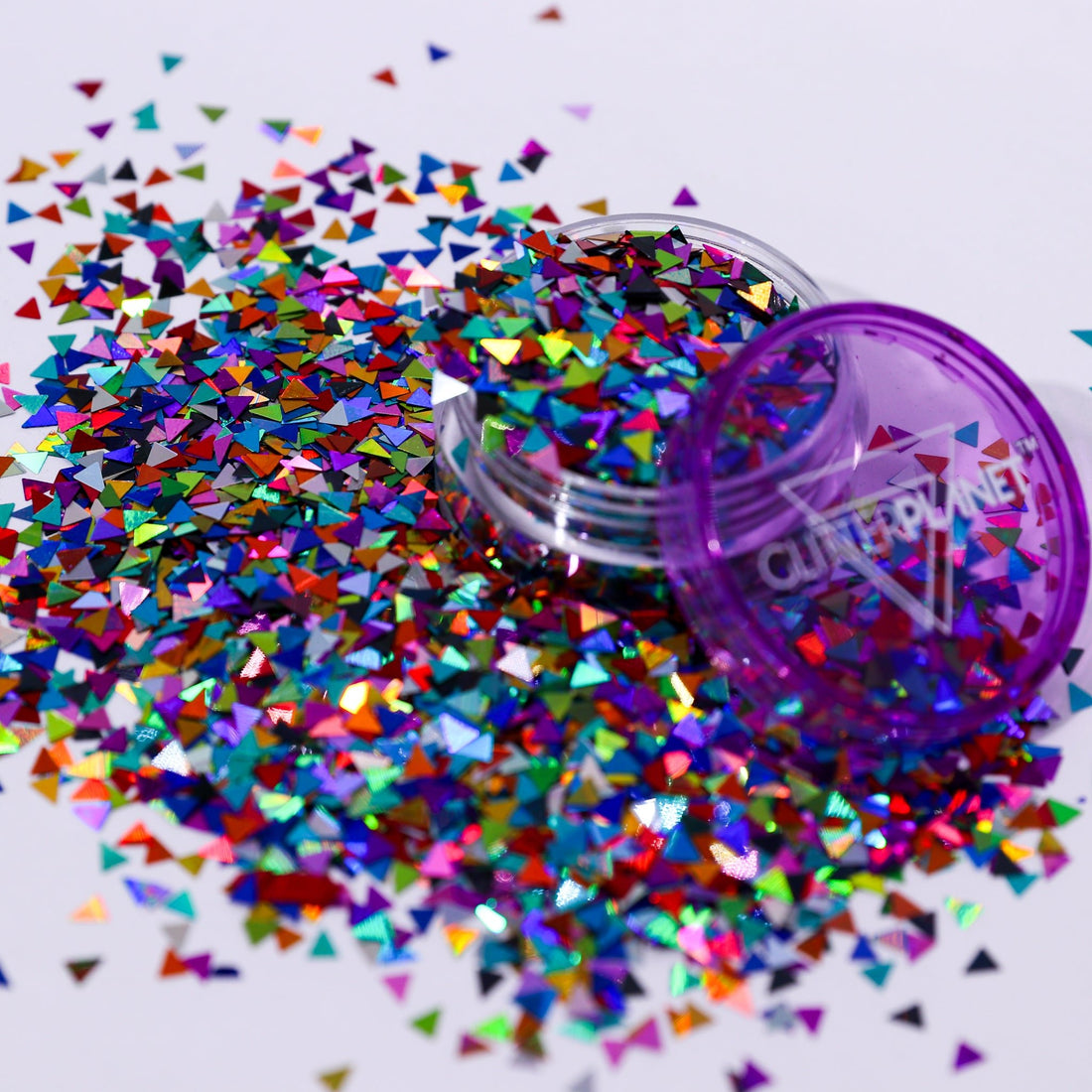 Colorful glitter scattered around a purple container with &
