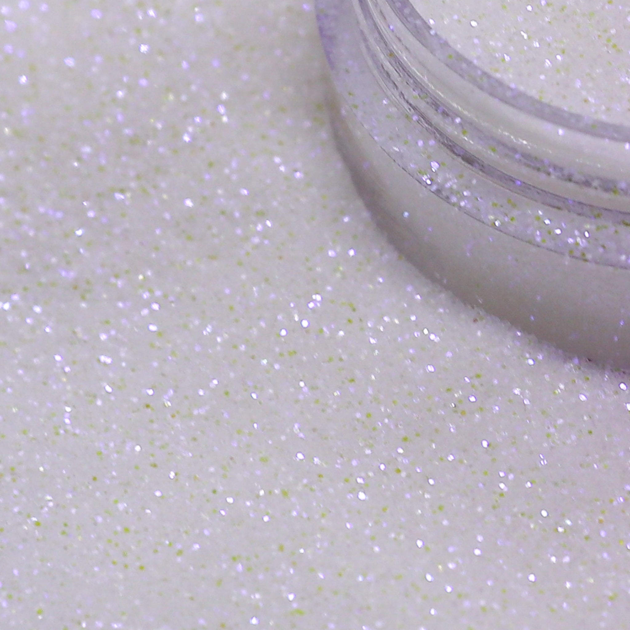 Close-up of a container of white glitter on a white background | Glitter Planet