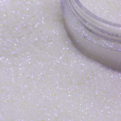 Close-up of a container of white glitter on a white background | Glitter Planet