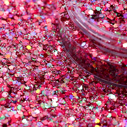Close-up of pink glitter with a clear container on a pink glitter background