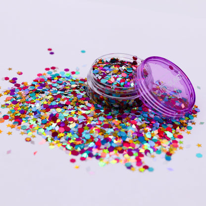 Colorful confetti scattered around a small container with a purple lid on a light gray background | Glitter Planet