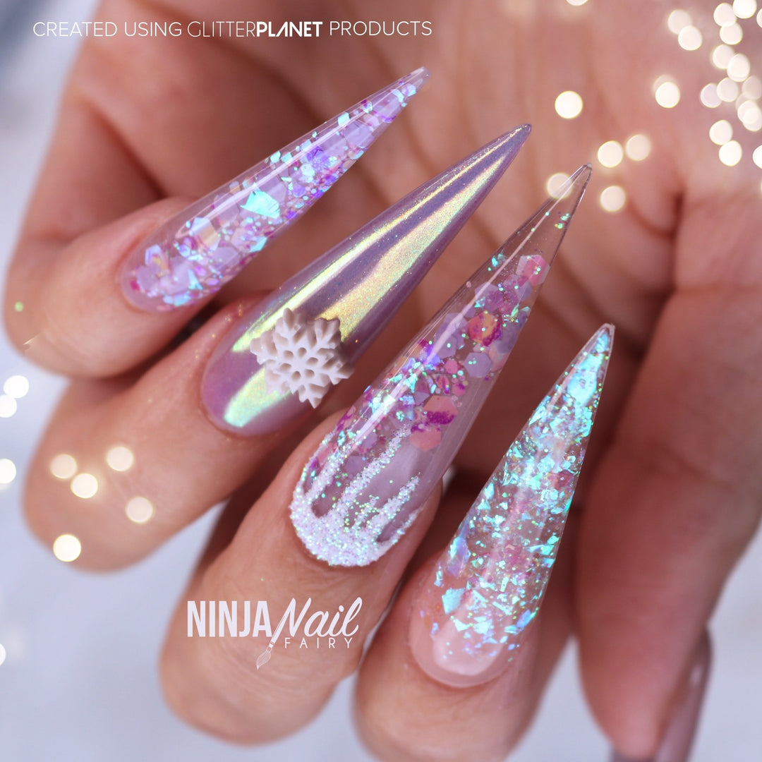 Aurora pigment and Swarovski crystals sculpted gel stiletto nails