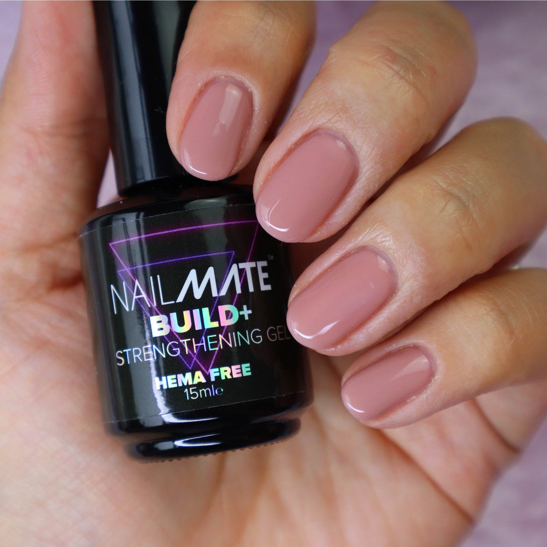 builder gel in a bottle with the gel painted on short length nails