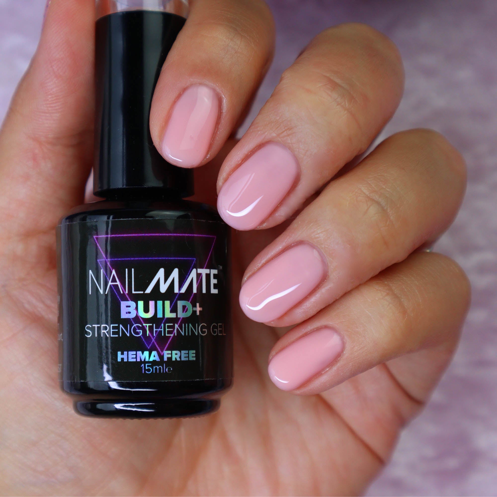 builder gel in a bottle with the gel painted on short length nails