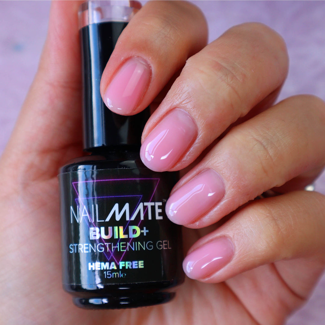 builder gel in a bottle light sheer pink with the gel painted on short length nails